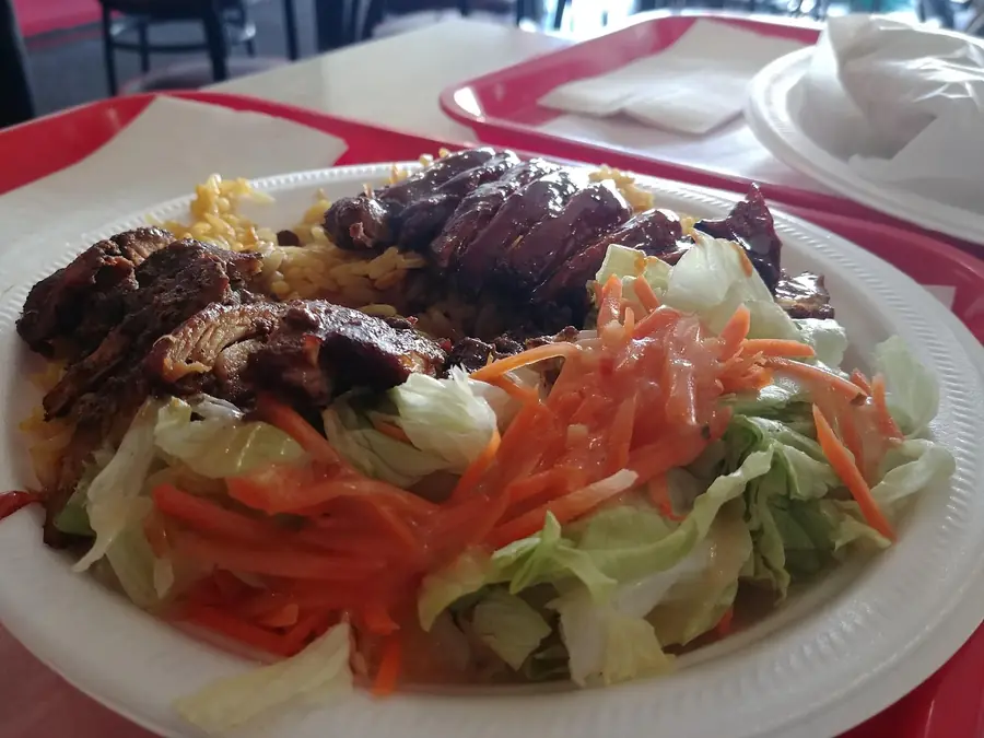 Jerk chicken plate with salad